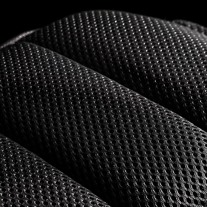 Mesh material for a black minimalistic anti-theft crossbody bag with built-in lock and external USB charging port.