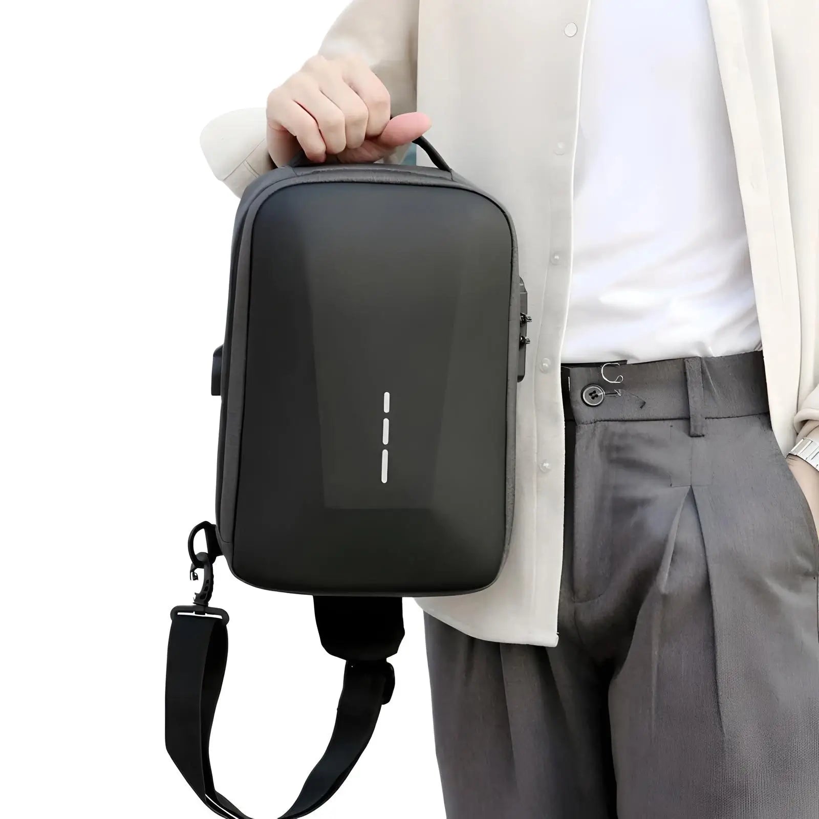 person holding black mega anti theft crossbody bag with built in lock and USB port