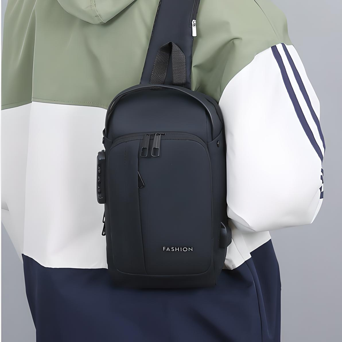 person wearing the black anti theft crossbody bag with multiple pockets, a built in lock and external usb port around their shoulder