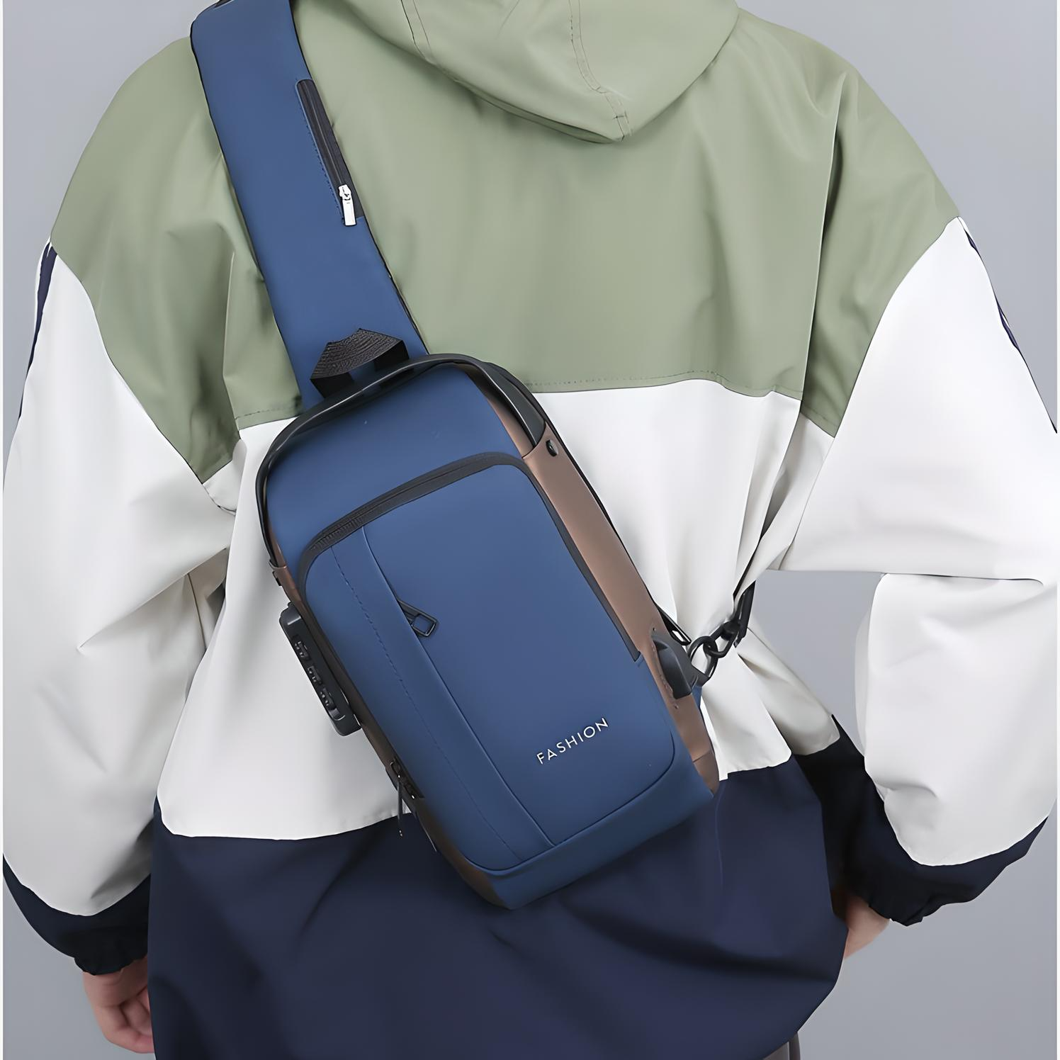 Person wearing a blue anti-theft crossbody bag with multiple pockets, a built-in lock, and an external USB port across their back.